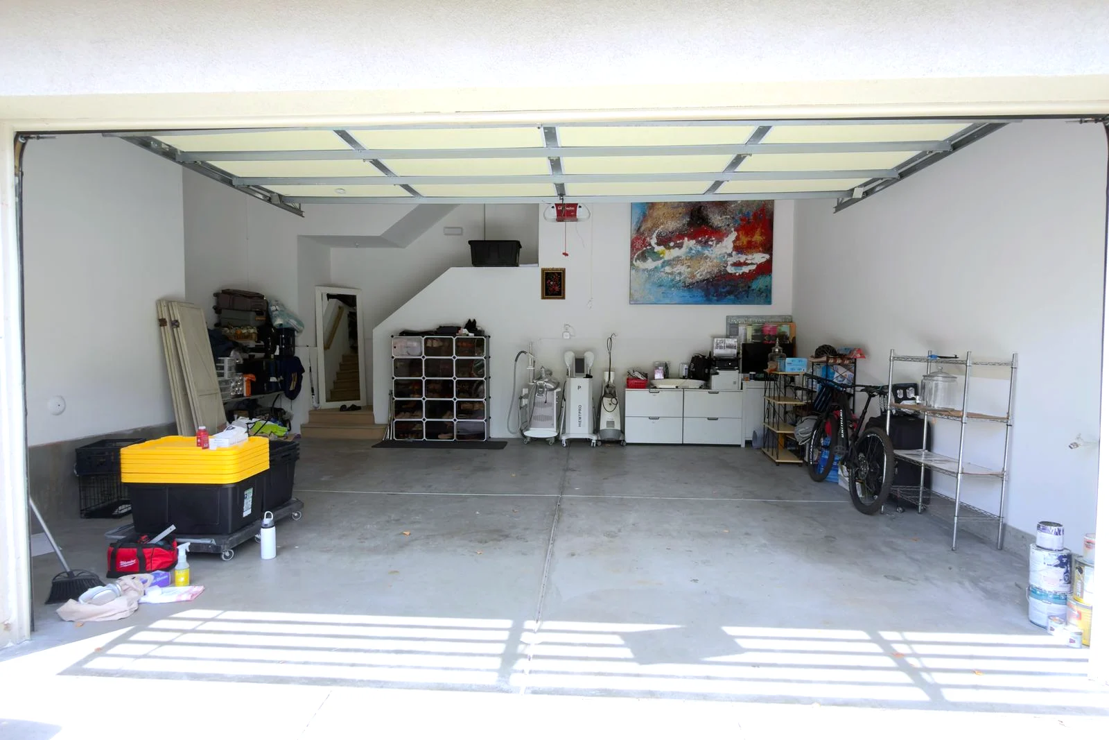 Cluttered garage in Orange County before an OC Garage Concierge declutter & organize